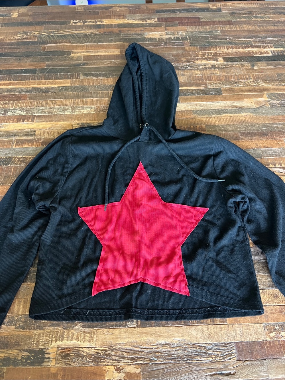 Black Hoodie with Red Star Graphic